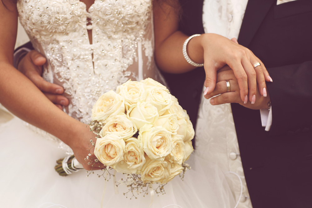 http://www.shutterstock.com/pic-182049293/stock-photo-detail-of-bride-s-roses-bouquet-and-hands-holding.html?src=xUSgw4xWP0sOEEN290eb6w-1-72&ws=1